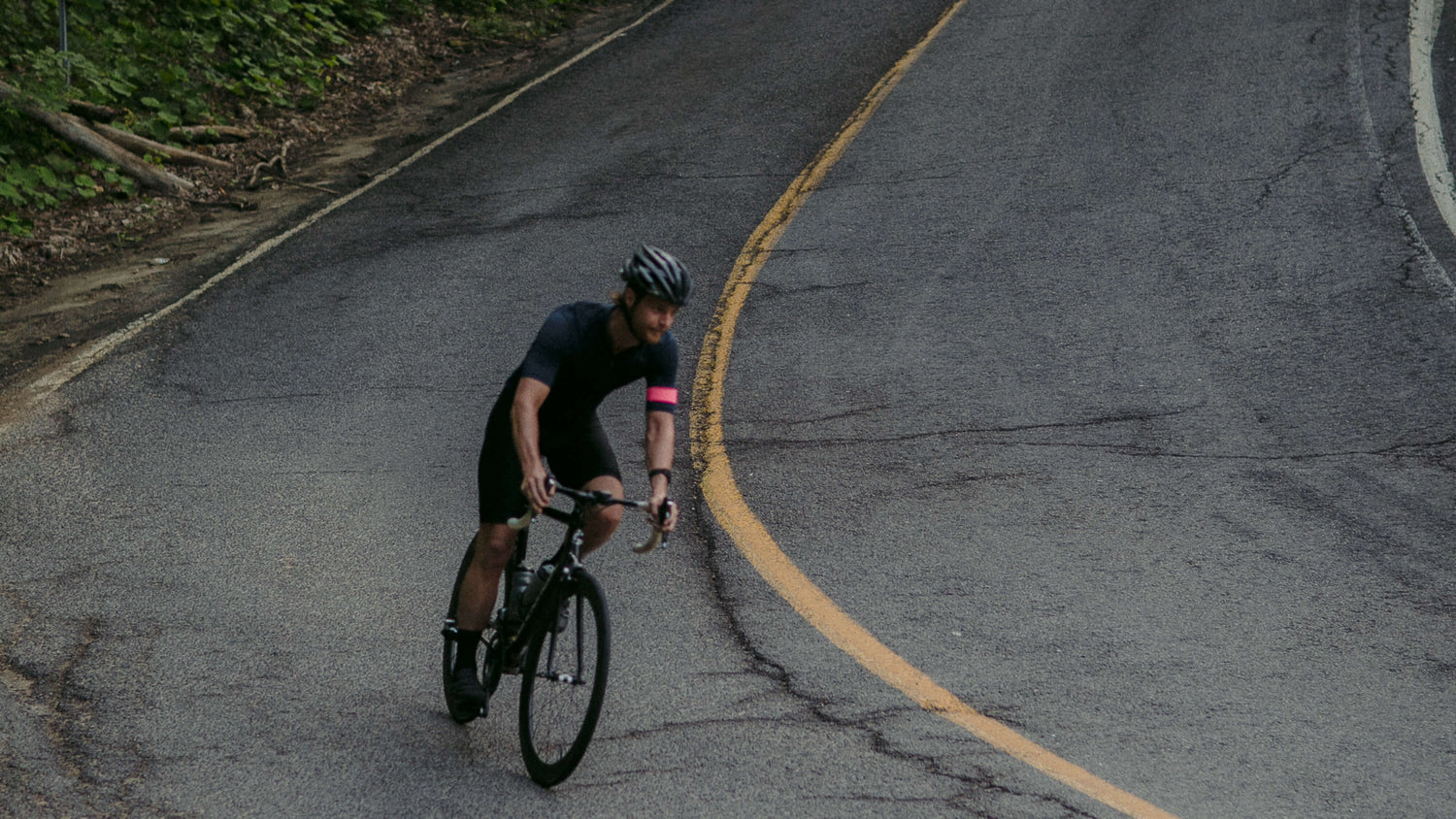 person cycling on road