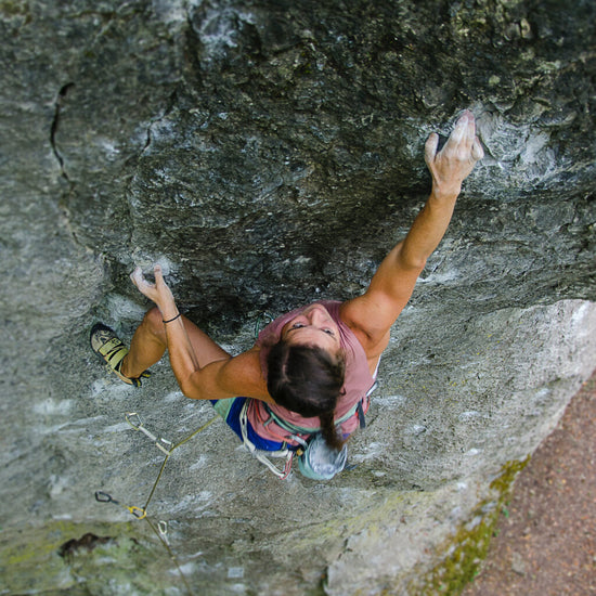 person rock climbing